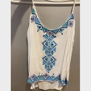 White flowy tank with blue embroidery